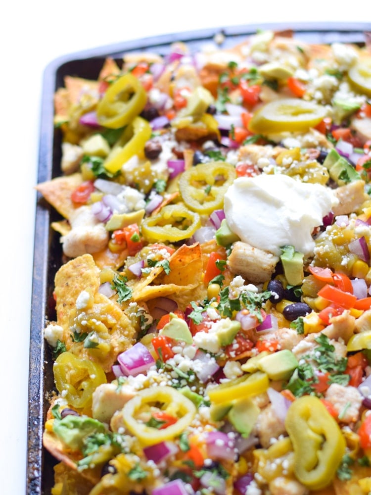 Nacho Chips topped with Jalapeños, Red Onion, Avocado, Black Beans, Tomatoes and Sour Cream.