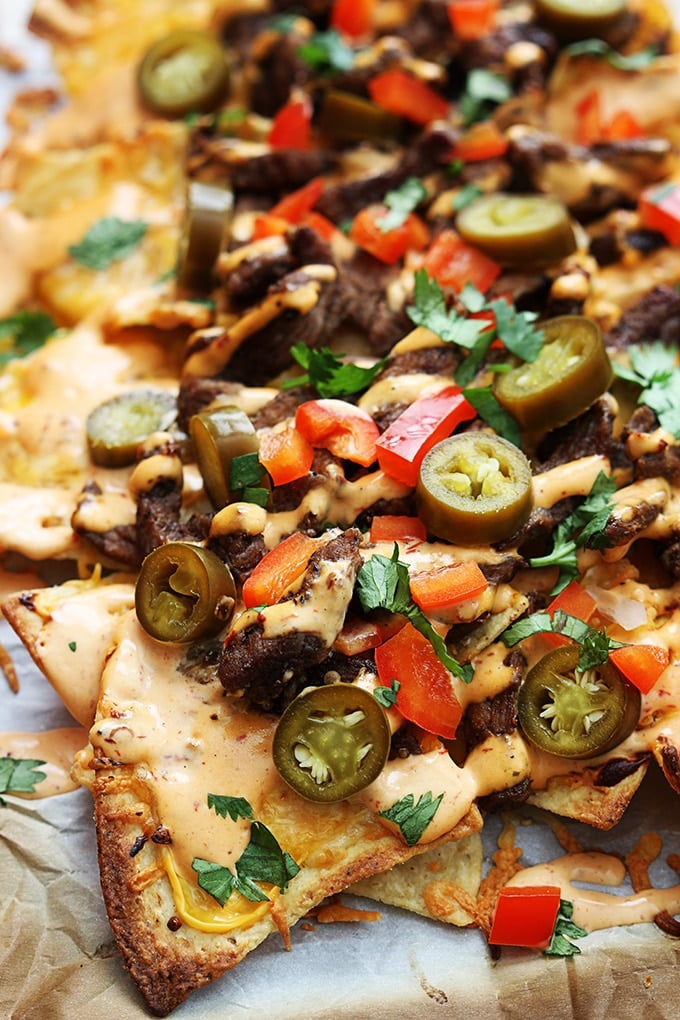 Steak Nachos topped with Jalapeños, Red Peppers and Cilantro.