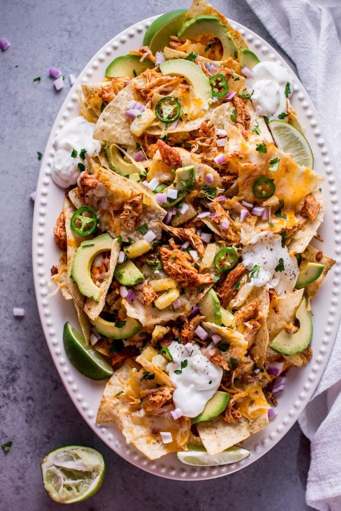 Nacho Chips topped with Avocado, Shredded Meat, Jalapeños and Sour Cream.