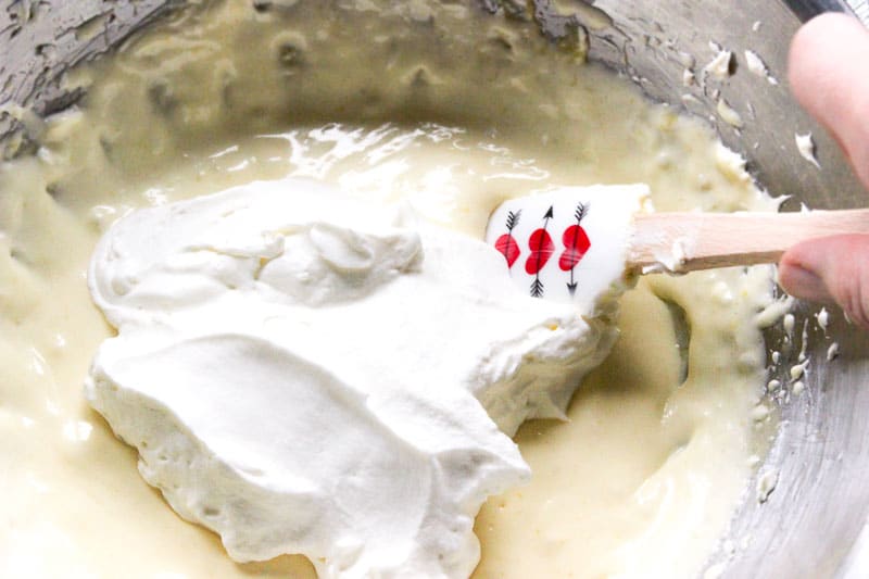 Folding Whipping Cream into Custard Mixture.