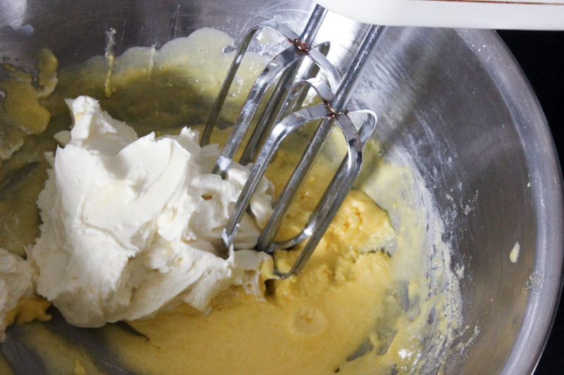 Adding Cream Cheese Mixture to Egg and Sugar Mixture.