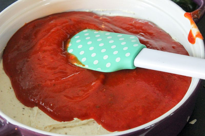 Spreading Pizza Sauce on Cream Cheese Mixture.