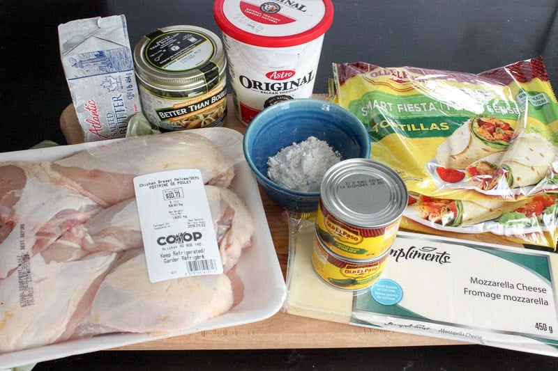 White Chicken Enchiladas Ingredients on Wooden Board.