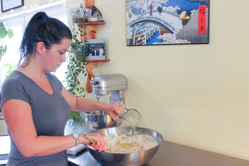 Woman Mixing Pizza Dough in Metal Mixing Bowl.