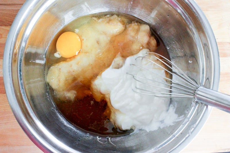 Mixing Egg, Mashed banana, yogurt and vanilla in Metal Mixing Bowl.
