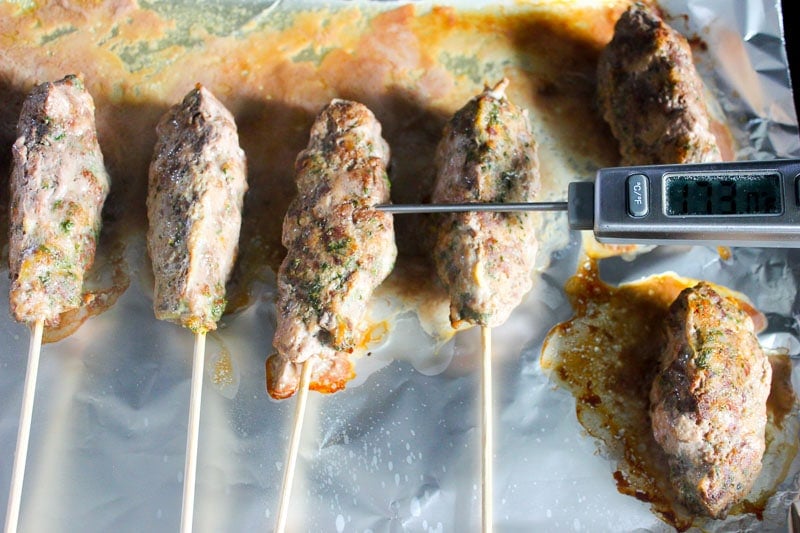 Testing Internal Temperature of Beef Kebabs with Meat Thermometer.