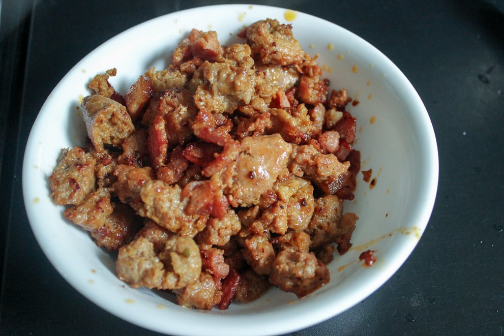 Bowl of fried ground Italian sausage and bacon
