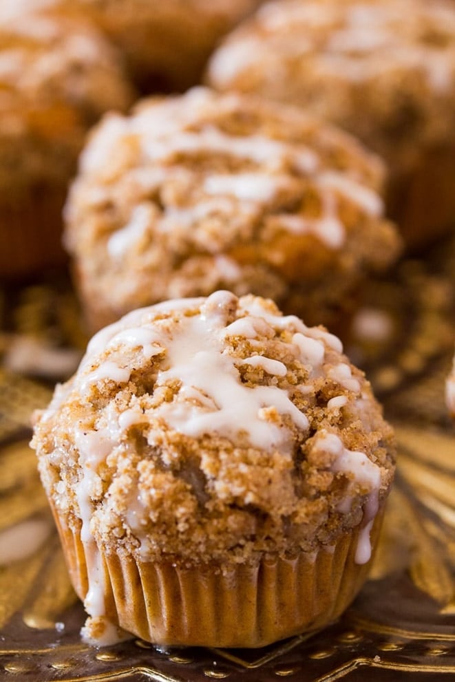 Close up of banana muffins with streusel and vanilla drizzle