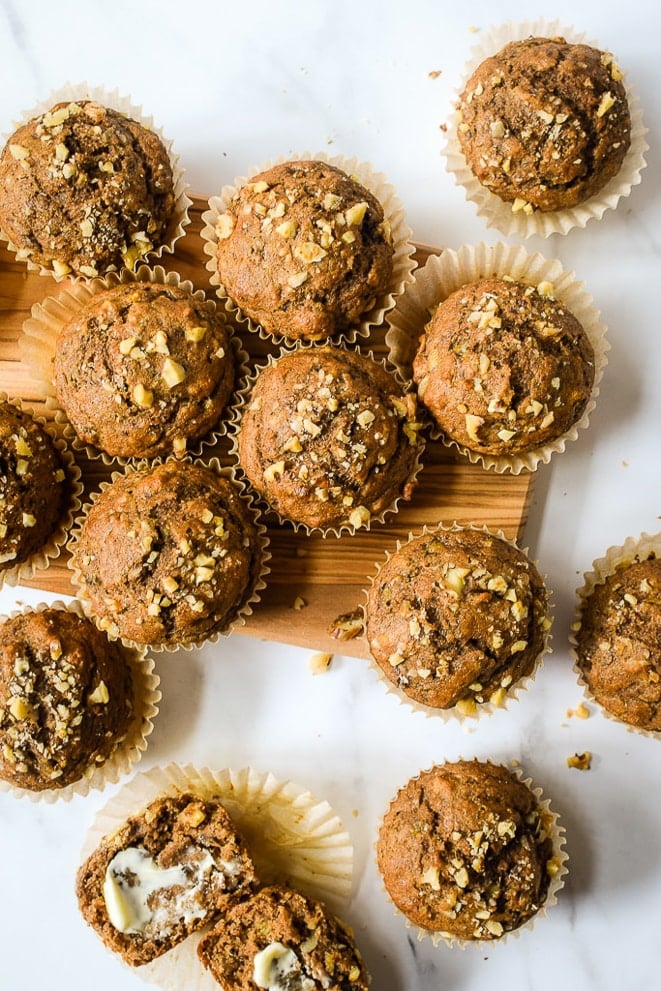 Whole wheat banana nut muffins on a cutting board