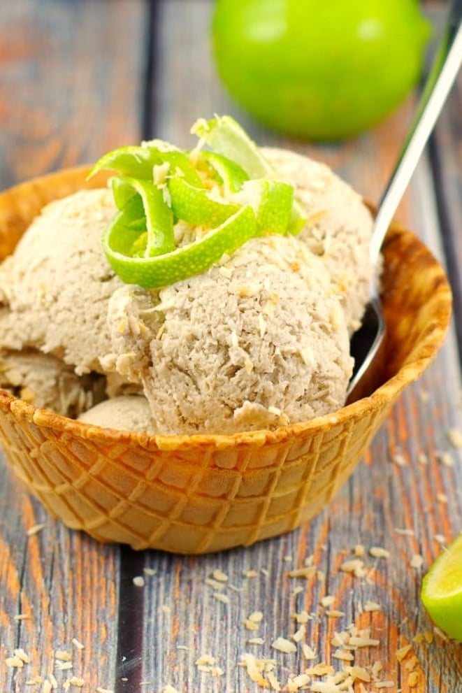 Waffle bowl filled with coconut lime banana ice cream, with lime zest on top