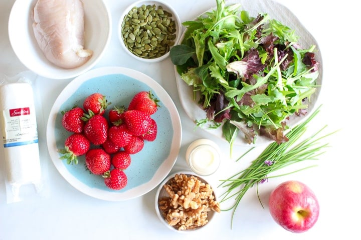 Chicken breast, strawberries, goat cheese, mixed greens, walnuts, apples, pumpkin seeds, chives