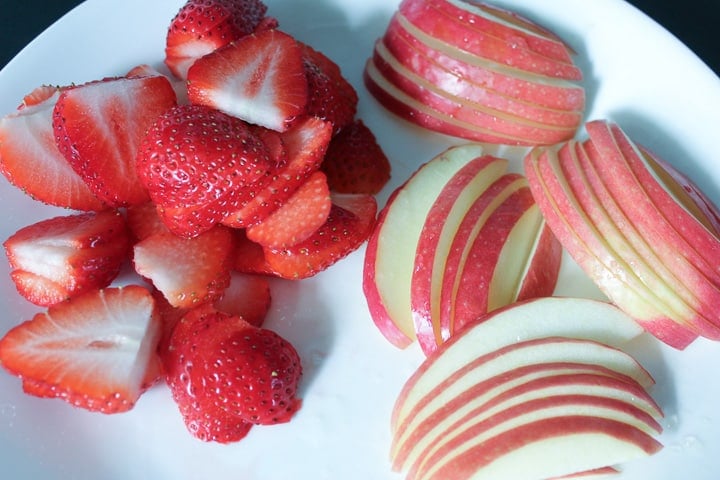 Slices of strawberries and apples for Strawberry Chicken Salad -