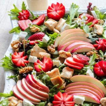 Platter of Strawberry Chicken Salad with sliced apples, walnuts and goat cheese