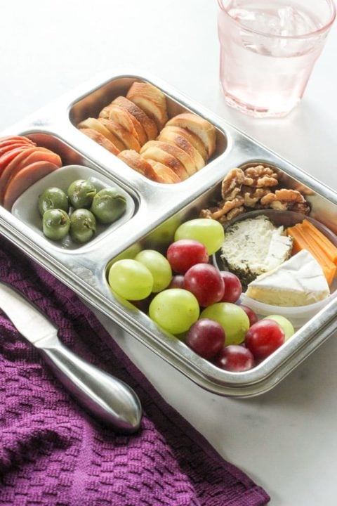 Healthy snacks inside metal rectangular pan.