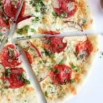Thin crust pizza with Italian salami, mozzarella cheese, apple, blue cheese and parsley