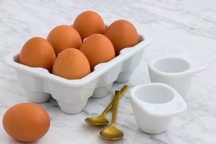 Brown eggs in ceramic egg carton