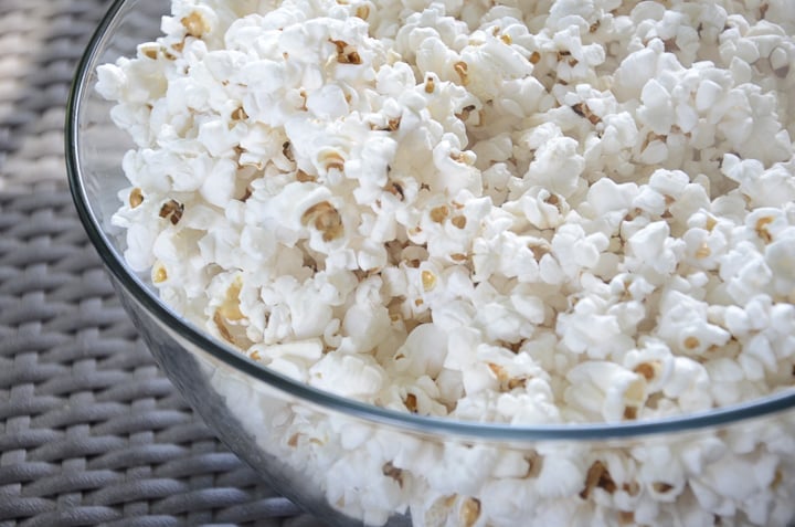 Large glass bowl of popcorn