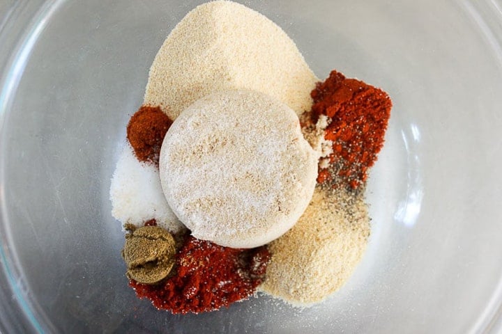 Bowl filled with various coloured spices and seasonings