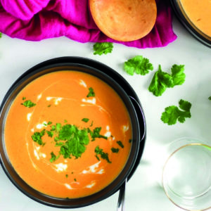 Bowl of orange Thai butternut squash soup ready to eat!
