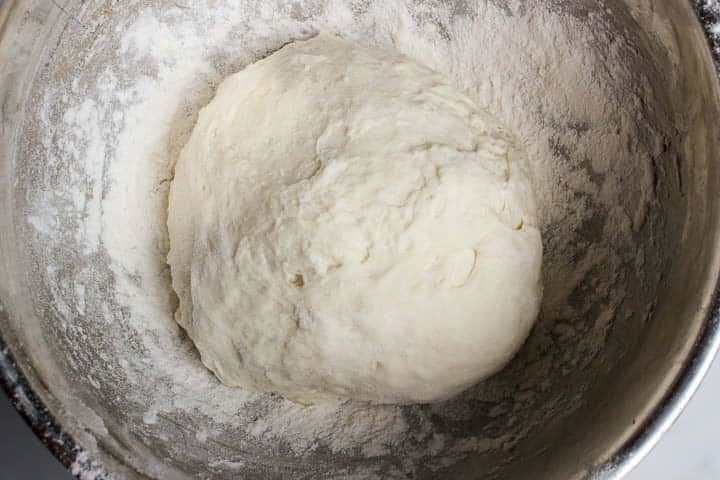 Bowl holding pizza dough that is ready to use