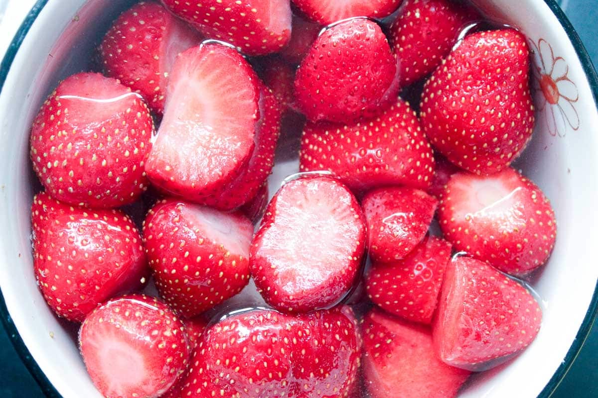 Close up of strawberries in a bowl of water