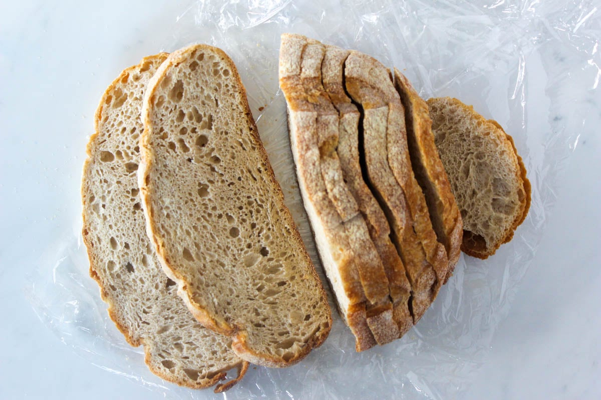 Slices of frozen sourdough bread defrosting.