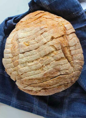Round loaf of sliced sourdough bread.