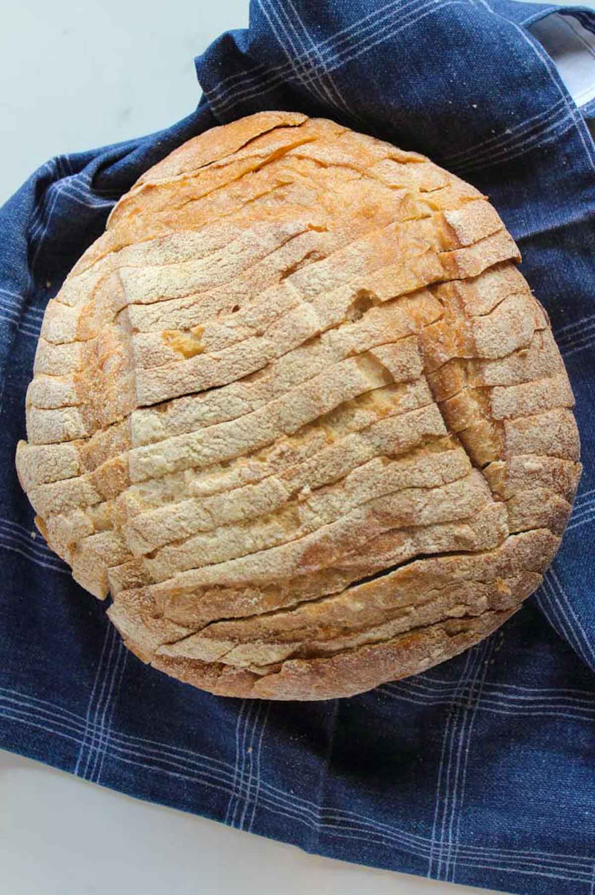 Round loaf of sliced sourdough bread.