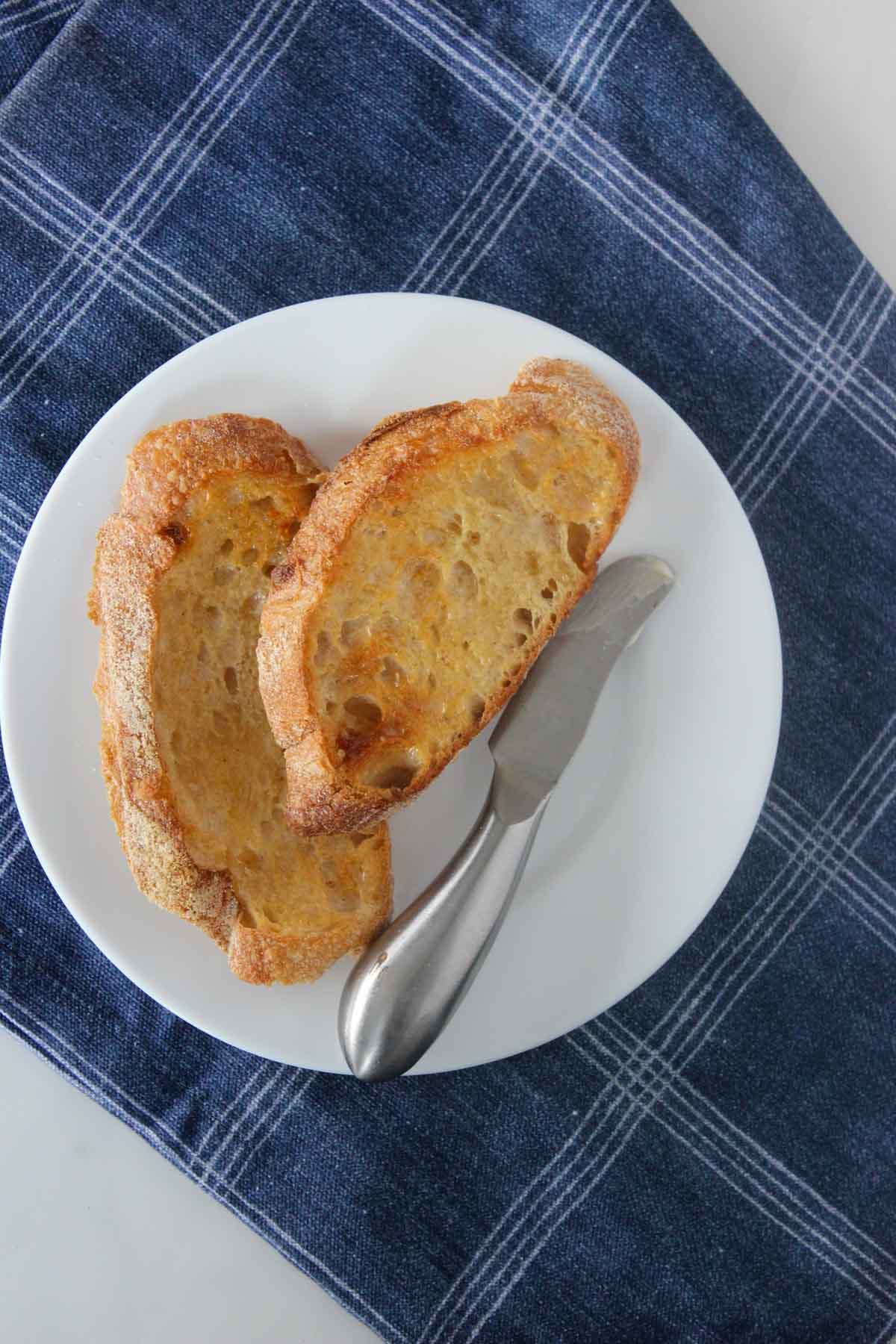 Slices of toasted sourdough bread on a plate.